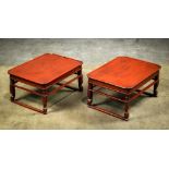 Pair of Korean red lacquered tray tables, the rectangular top with lobed corners, raised on shaped