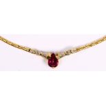 Ruby, diamond and 14k yellow gold necklace Featuring (1) pear-cut ruby, weighing approximately 1.