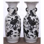 Pair of large Chinese porcelain vases, each of baluster form featuring brown fu-lions playing with a