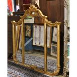 Louis XV style gilt wood wall mirror, having three mirrored panels and surmounted by a foliate