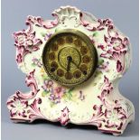 Continental faience mantle clock, having a foliate motif, the gilt dial with Arabic numerals, 11"h x