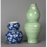 (lot of 2) Chinese double gourd vases: one of blue-and-white with prunus on a crackled ice ground;