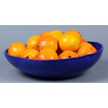 Betty Spindler (Californian born 1943) ceramic sculpture, 'Blue Bowl with Oranges' depicting a