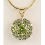 Peridot and 14k yellow gold pendant-necklace Featuring (9) round-cut peridots, weighing a total of