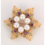 Cultured pearl, ruby and 14k gold flower brooch Designed as a flower, featuring (6) 6.3 mm