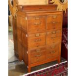 Quarter sawn oak filling cabinet, having six drawers with brass pulls, and rising on square legs,