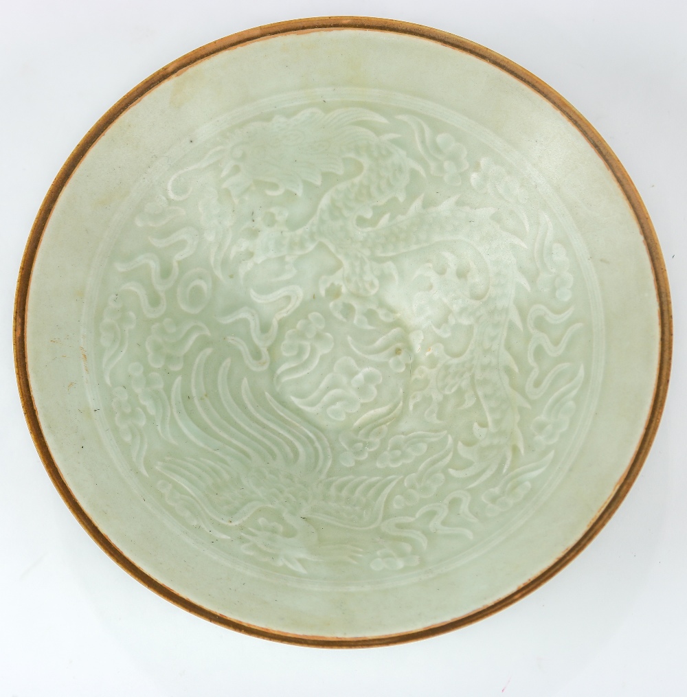 Chinese qingbai glazed ceramic bowl, the interior featuring a dragon and phoenix amid clouds, raised - Image 3 of 4