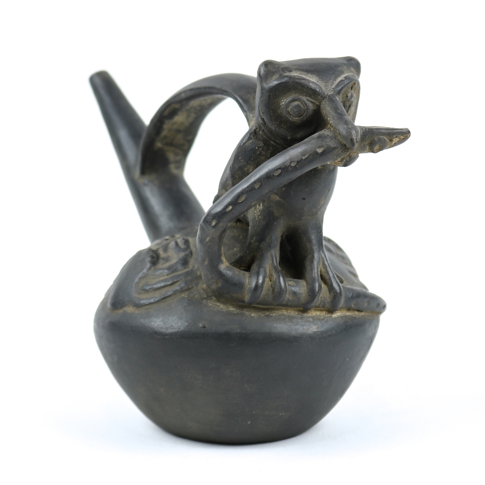 Chimu blackware effigy stirrip vessel, Northern Peru, Early Chimu (pre 1200 A.D.), an owl holding