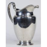 Tiffany & Co. sterling silver pitcher, having a tapering ovoid shape and a highly polished body,