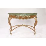 Rococo style gilt console table, having a faux marble shaped top over the gilt composite frame,