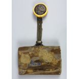 Japanese tobacco pouch with a kagamibuta netsuke, silver plaque of a dragon in the center,