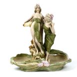 Royal Dux porcelain figural centerpiece, executed in the Art Nouveau style, depicting two beauties