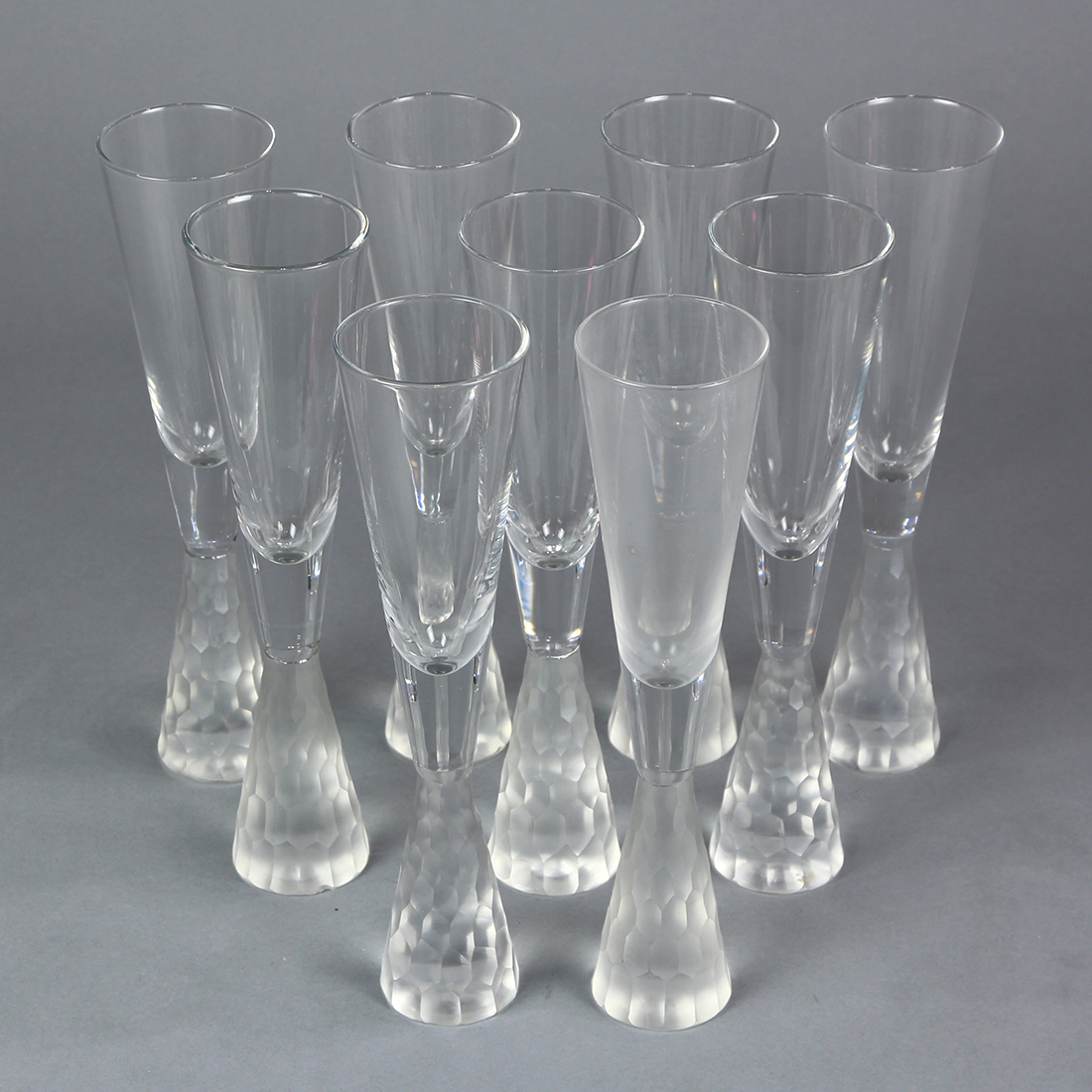 (lot of 9) Contemporary crystal champagne flutes, having a clear bowl rising on the frosted and - Image 2 of 2