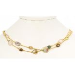 Tourmaline, sterling silver gilt necklace Featuring (29) irregular tourmaline slices, measuring