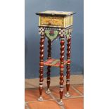 Custom two tier side table, having a multicolor polychrome decorated top, and rising on barley twist