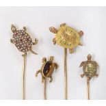 (Lot of 4) Diamond, ruby, seed pearl, tiger's eye and 14k yellow gold turtle stickpins Including (1)