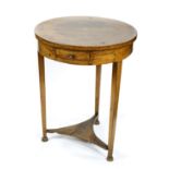 Biedermeier style gueridon, having a circular top, above a single drawer, rising on tapered legs