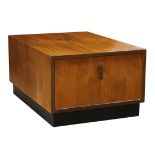 Mid-Century Modern walnut occasional table, having a rectangular top, above a single door, and