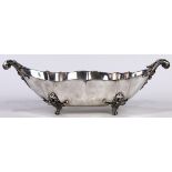 Italian .800 silver fruit bowl, having an oval lobbed form, with scrolled leaf handles and rising on