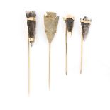 (Lot of 4) Glass, 10k yellow gold and metal arrowhead stickpins Including (3) glass and 10k gold