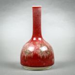 Chinese peach bloom glazed porcelain vase, with a stick neck above a domed body, base with an