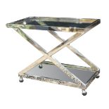Italian Moderne style tea cart, having a chrome frame with two glass tiers and rising on a wheeled