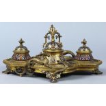 Belle Epoque bronze and enamel inkwell, the centered inkwell enclosed by two troughs and flanked