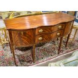 Federal style inlaid mahogany sideboard, having a shaped top above the two drawer case having oval