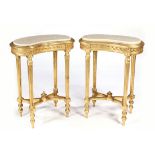 Pair of Louis XVI style giltwood carved occasional tables, each having a kidney form top and