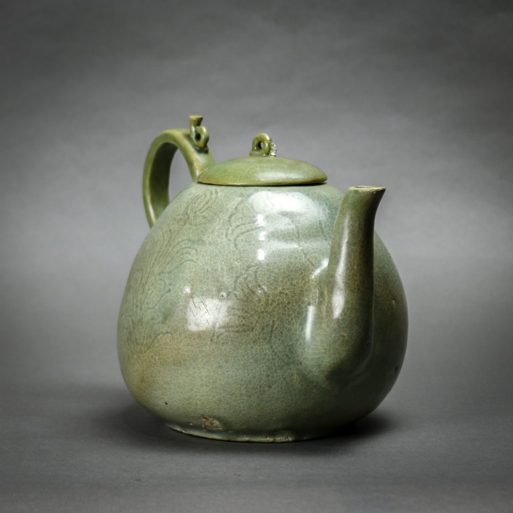 Korean celadon glazed ceramic teapot, the body of peach form incised with floral sprigs, topped by a - Image 3 of 6