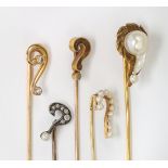 (Lot of 5) Victorian diamond, pearl, elk's tooth, gold-in-quartz and gold "?" stickpins Including (