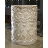 Composite umbrella stand, having a circular form, the body with a foliate motif, 16"h x 11.5"dia.