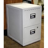 Metal file cabinet or safe, having two drawers.