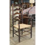 Provincial ladder back armchair, with turned posts and (5) shaped horizontal slats over the rush