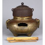 Japanese furo (portable brazier) and iron chagama kettle with lid for tea ceremony, handles and