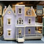 Victorian style dollhouse, having an unfinished interior and exterior, 33.5"h x 36"d x 22"d