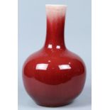 Chinese ox blood glazed porcelain vase, with a slightly tapering cylindrical neck above a globular