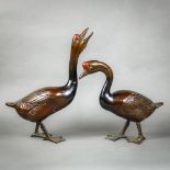 (lot of 2) Japanese pair of bronze geese with red crowns, one stretching its neck the other