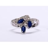Sapphire, diamond and 14k white gold ring Featuring (3) oval-cut sapphires, weighing a total of