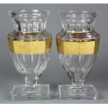 (lot of 2) Pair of Moser clear glass vases, each in the "Cleopatra 624" pattern, having an urn form,