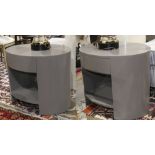 Pair of Moderne gray night stands, each having an oval form with a single centered drawer above