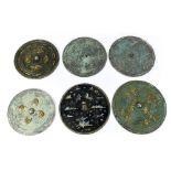 (lot of 6) Chinese circular bronze mirrors: three cast with mythical animals in low relief; one with