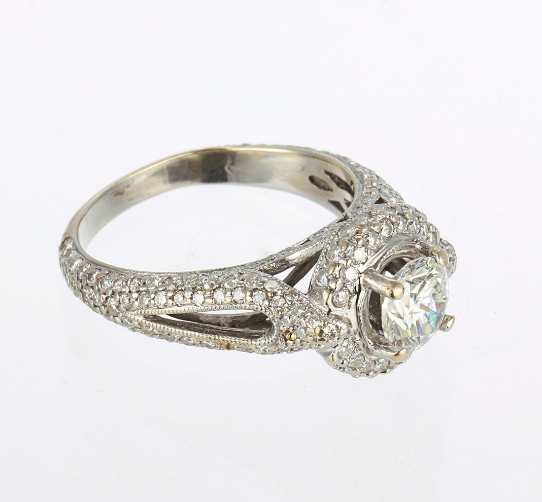 Diamond and 14k white gold ring Centering (1) round brilliant-cut diamond, weighing 0.91 ct.,