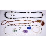 Collection of multi-stone and yellow metal jewelry Including 1) carved lapis lazuli and metal