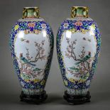 Pair of Chinese enameled metal vases, each with a short flared neck bracketed by handles, above