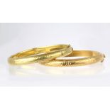 (Lot of 2) 14k yellow gold bracelets Including 1) 7.8 mm, 14k yellow gold hinged, engraved bangle