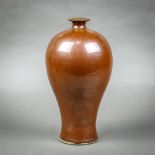 Chinese Ding-type persimmon glaze vase, of meiping form with high shoulders and fluidly tapering