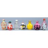 (lot of 7) Chinese glass snuff bottles: one clear glass with a tall flattened body; one of yellow
