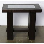 Arts and Crafts style side table, having a rectangular inset glass top, and rising on straight