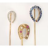 (Lot of 3) Ruby, sapphire, diamond and platinum, yellow gold horse shoe stickpins Including (1)